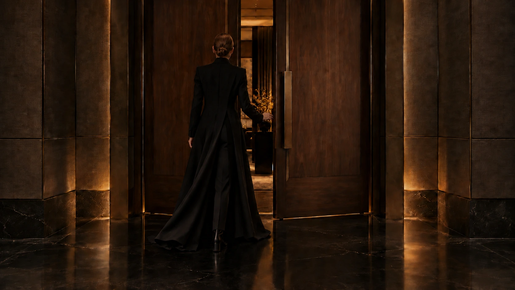 Anonymous figure in a long black coat, seen from behind at open doors